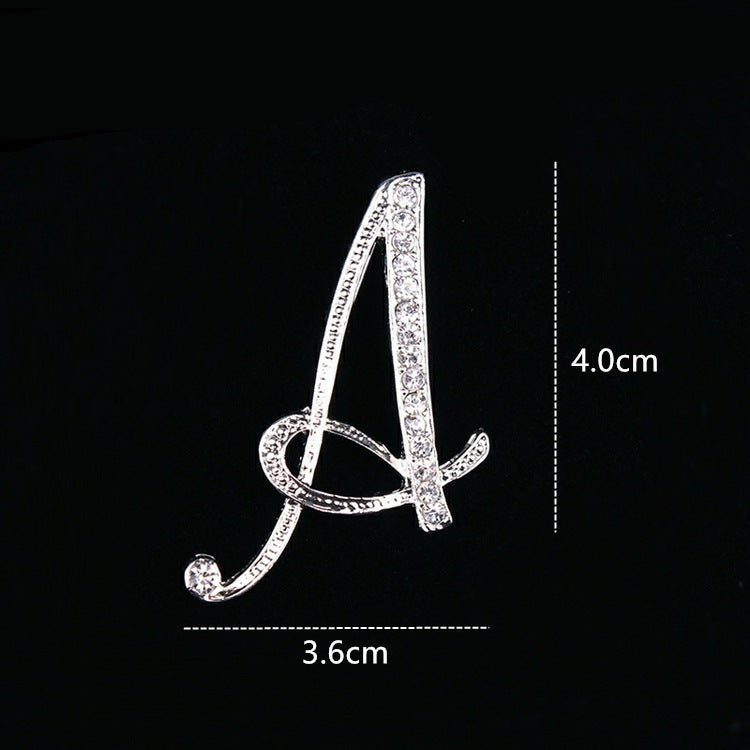 English letter brooch with diamonds