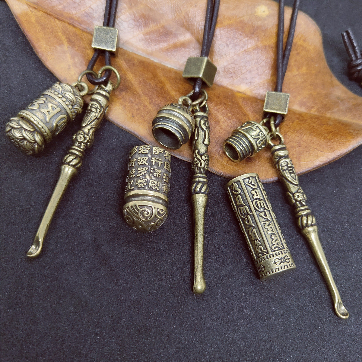 Close-up of Brass Spoon Jar Pendant - Style B
brass jar pendant, mini spoon necklace, leather rope necklace, unique pendant jewelry, rustic brass necklace, boho style necklace, trendy pendant accessories, minimalist jewelry, brass pendant