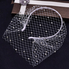 Close-up of lampshade-style mesh headband with rhinestones