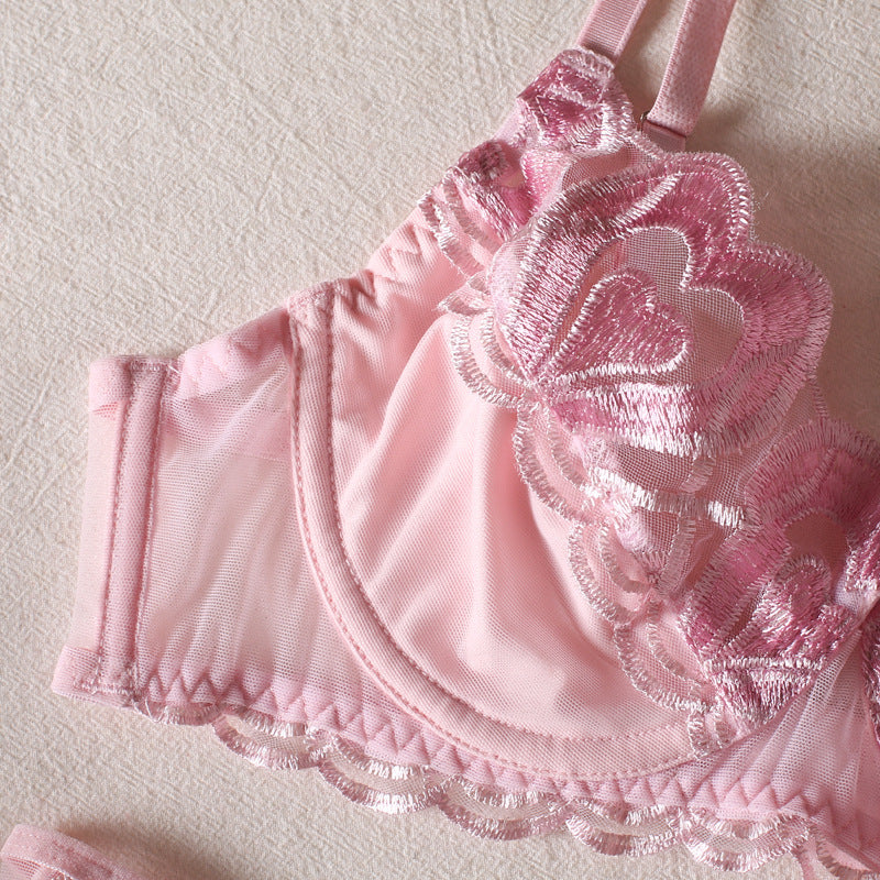 Close-up of three-row buckle closure on black lingerie set.