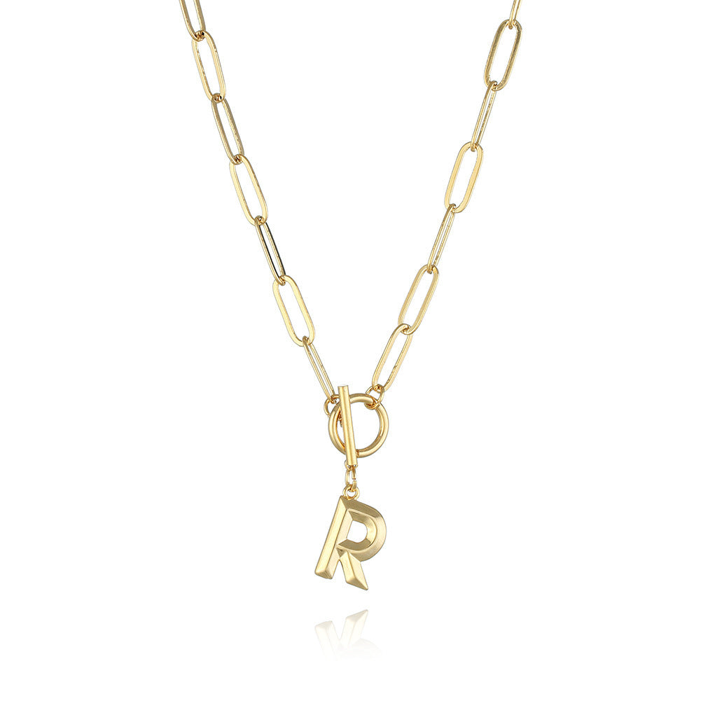 R letter pendant necklace featuring a gold electroplated finish